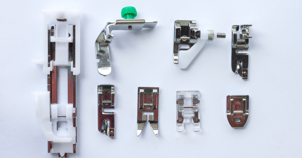 Eight different kinds of sewing machine presser feet neatly arranged on a white background.